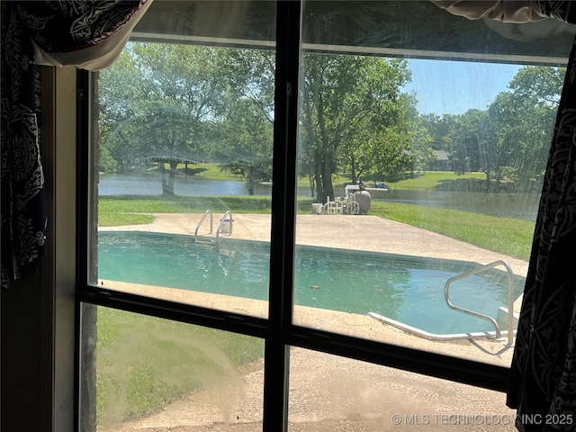 514 Lakeshore St, Durant, OK 74701 - view of swimming pool with a water view and view of scattered trees