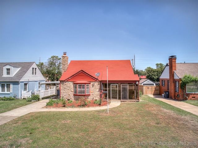 3923 E 11th Pl, Tulsa, OK 74112 - view of front of property featuring a chimney, stone siding, and a sunroom