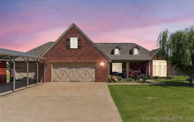 51 Willow Dr, Pryor, OK 74361 - traditional home with brick siding, a lawn, concrete driveway, and a garage