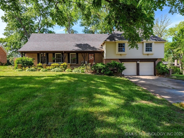 1811 Wayland Ct, Bartlesville, OK 74006 - tri-level home with brick siding, an attached garage, concrete driveway, and a front lawn
