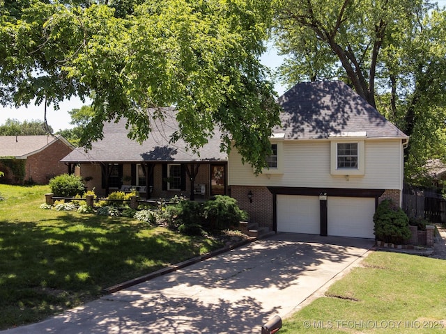 1811 Wayland Ct, Bartlesville, OK 74006 - view of front of house featuring brick siding, a garage, concrete driveway, and a front lawn