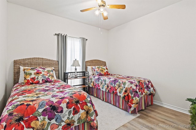 64 Floyd Everet, Colbert, OK 74733 - bedroom featuring baseboards, wood finished floors, and a ceiling fan