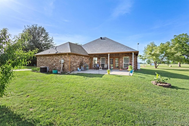 64 Floyd Everet, Colbert, OK 74733 - back of house with a patio, a yard, brick siding, central AC unit, and a shingled roof