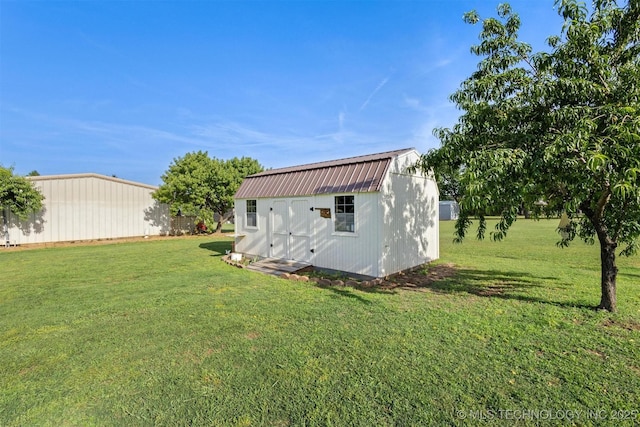 64 Floyd Everet, Colbert, OK 74733 - view of grassy yard featuring a shed and an outdoor structure
