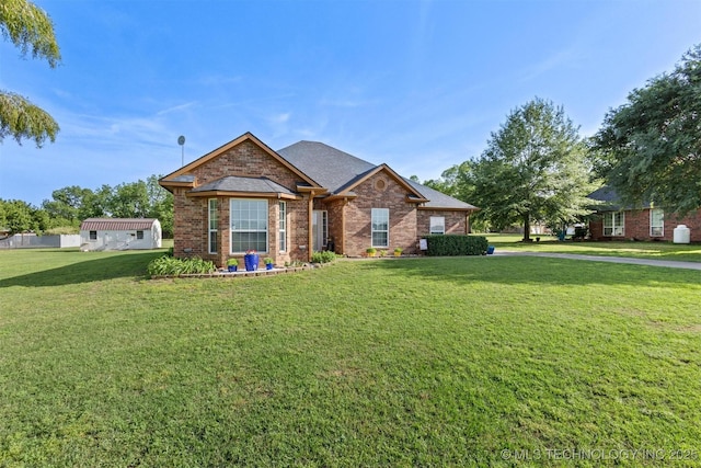 64 Floyd Everet, Colbert, OK 74733 - view of front of home with a front lawn, brick siding, and roof with shingles