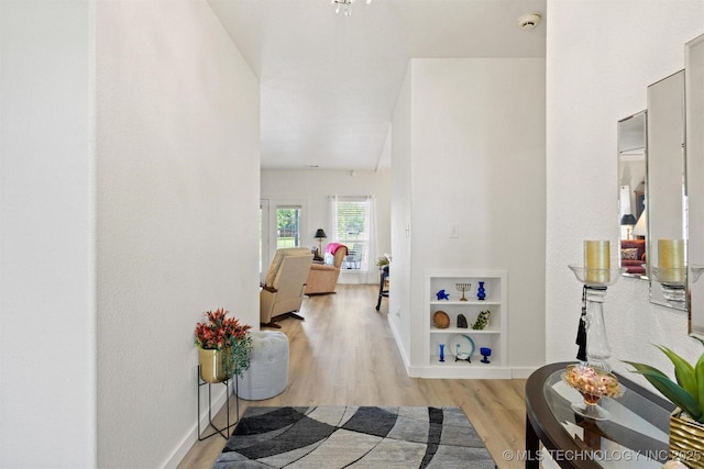 64 Floyd Everet, Colbert, OK 74733 - hall featuring wood finished floors, baseboards, and built in features