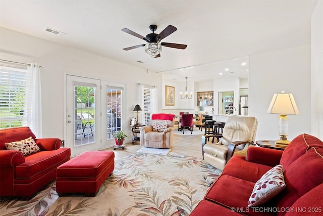 64 Floyd Everet, Colbert, OK 74733 - living area featuring a chandelier and ceiling fan