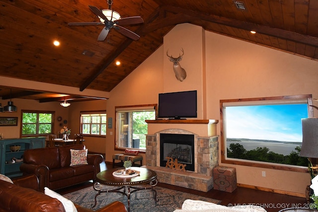 96729 S 4490, Vian, OK 74962 - living area featuring wood ceiling, wood finished floors, beam ceiling, a stone fireplace, and ceiling fan