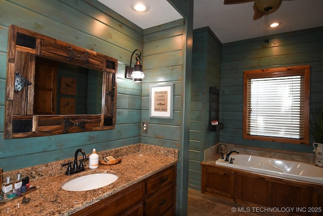 96729 S 4490, Vian, OK 74962 - full bathroom featuring wood walls, a garden tub, vanity, and ceiling fan