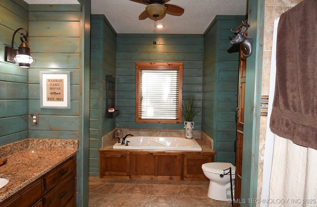 96729 S 4490, Vian, OK 74962 - bathroom featuring vanity, a bath, toilet, ceiling fan, and a textured ceiling