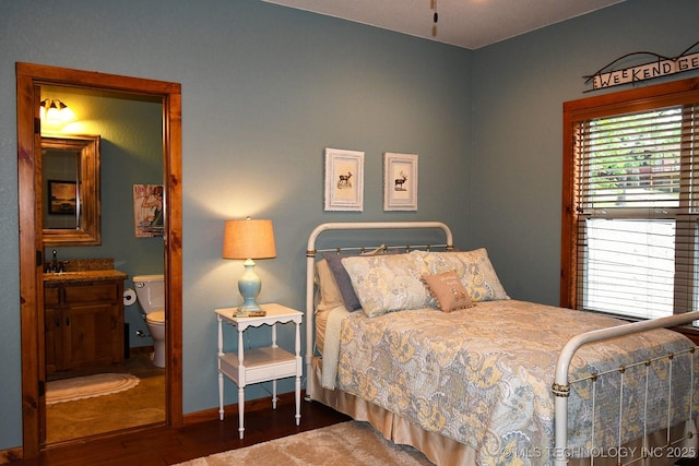 96729 S 4490, Vian, OK 74962 - bedroom featuring wood finished floors, a sink, baseboards, and ensuite bath