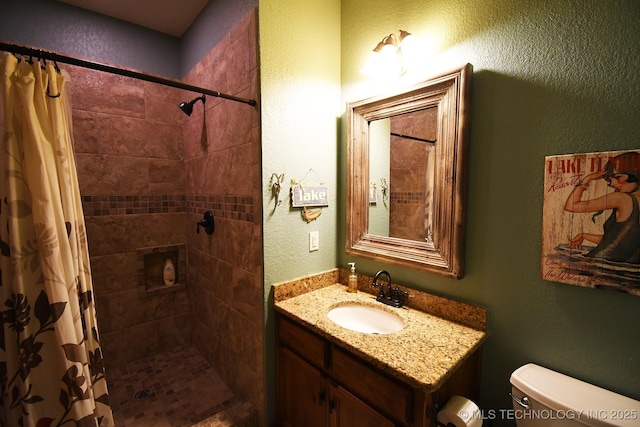 96729 S 4490, Vian, OK 74962 - full bathroom with tiled shower, toilet, a textured wall, and vanity