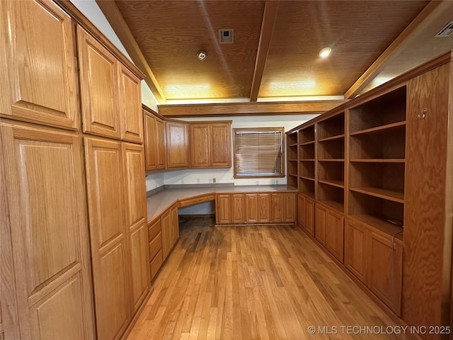 924 9th Ave SE, Ardmore, OK 73401 - unfurnished office with built in desk, light wood-type flooring, wood ceiling, and beamed ceiling