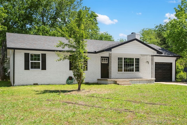 single story home featuring an attached garage, brick siding, and a front yard