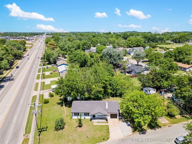 aerial view of a main thoroughfare and a tree filled landscape