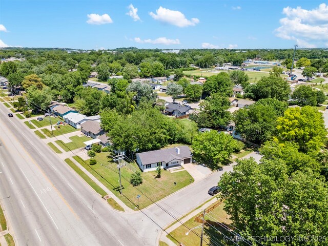 aerial view of residential area with a tree filled landscape