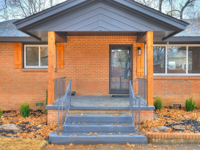 2528 E 57th St, Tulsa, OK 74105 - doorway to property with brick siding and crawl space