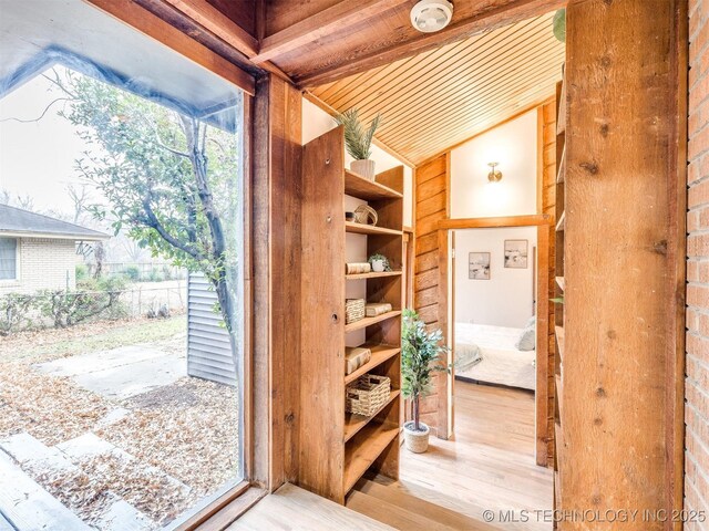 2528 E 57th St, Tulsa, OK 74105 - doorway to outside with vaulted ceiling and wood finished floors
