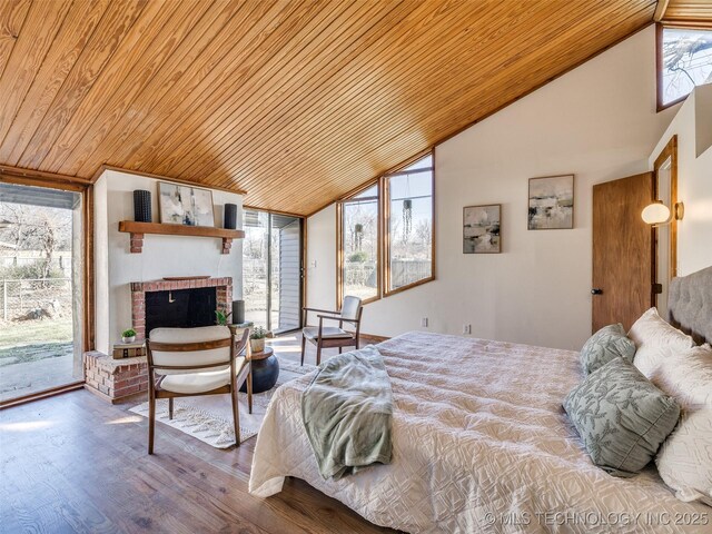 2528 E 57th St, Tulsa, OK 74105 - bedroom with wooden ceiling, access to exterior, high vaulted ceiling, wood finished floors, and a brick fireplace