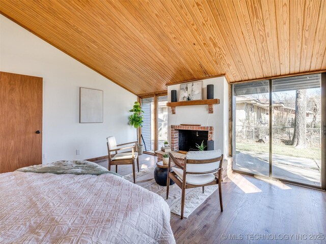 2528 E 57th St, Tulsa, OK 74105 - bedroom featuring wooden ceiling, vaulted ceiling, access to outside, a fireplace, and wood finished floors
