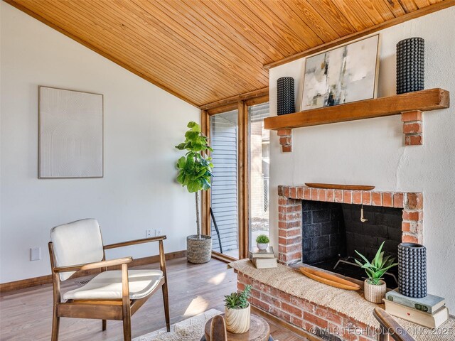 2528 E 57th St, Tulsa, OK 74105 - living room featuring wooden ceiling, lofted ceiling, a brick fireplace, baseboards, and wood finished floors