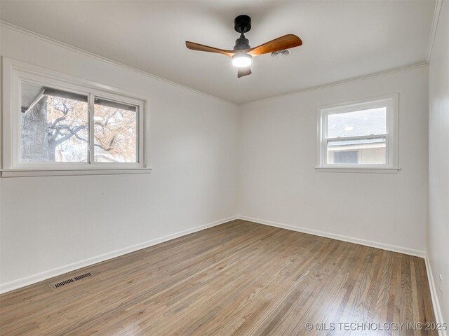 2528 E 57th St, Tulsa, OK 74105 - spare room featuring crown molding, light wood-style flooring, a ceiling fan, and baseboards