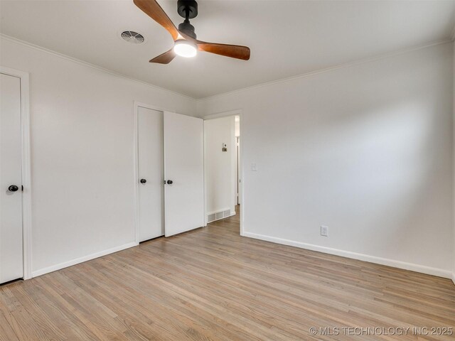 2528 E 57th St, Tulsa, OK 74105 - unfurnished bedroom featuring light wood-type flooring, ornamental molding, baseboards, and a ceiling fan