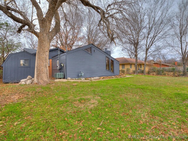 2528 E 57th St, Tulsa, OK 74105 - rear view of house with a chimney, a shed, and an outbuilding