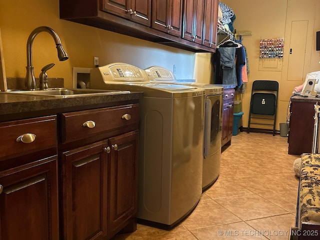 1216 N Oak Grove Rd, Drumright, OK 74030 - laundry area featuring washer and dryer, cabinet space, and light tile patterned flooring