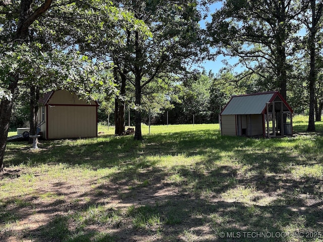 1216 N Oak Grove Rd, Drumright, OK 74030 - view of grassy yard with a shed and an outdoor structure