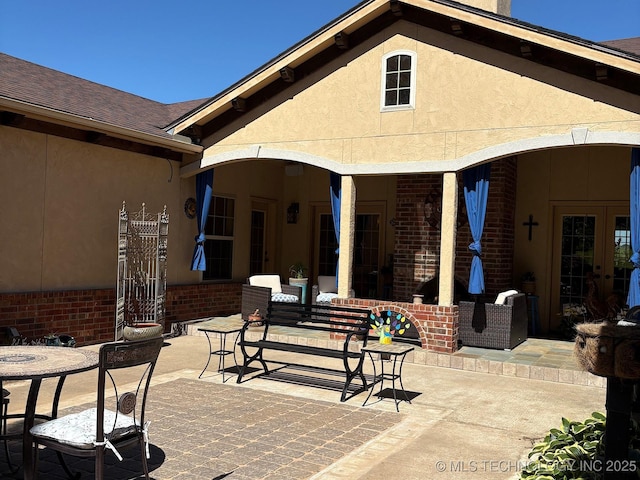 1216 N Oak Grove Rd, Drumright, OK 74030 - view of patio / terrace with french doors and outdoor dining space