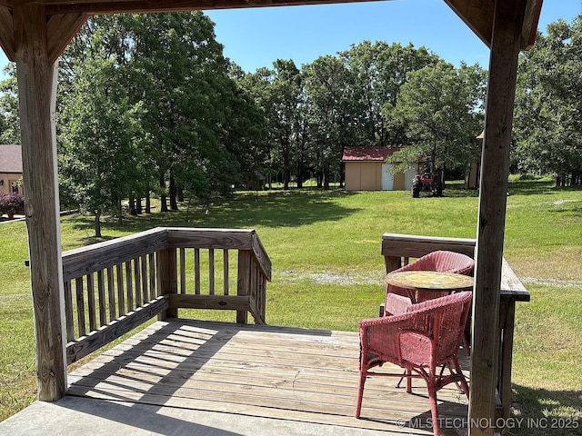 1216 N Oak Grove Rd, Drumright, OK 74030 - wooden deck with a yard, an outbuilding, and a storage unit
