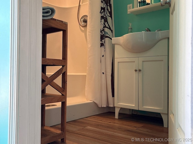 1216 N Oak Grove Rd, Drumright, OK 74030 - full bathroom featuring wood finished floors, vanity, and curtained shower