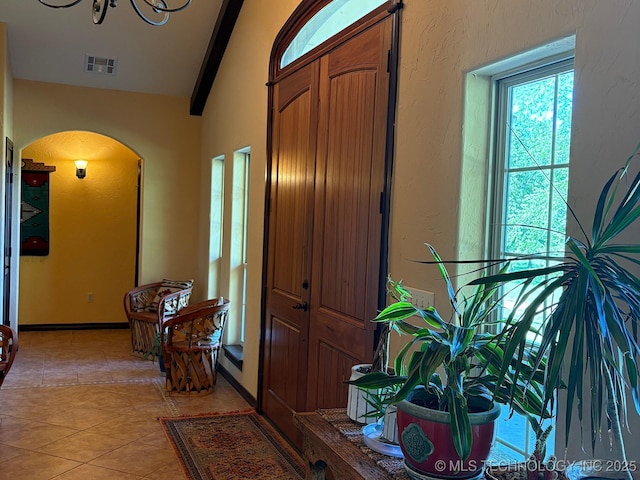 1216 N Oak Grove Rd, Drumright, OK 74030 - foyer entrance featuring arched walkways, light tile patterned floors, and vaulted ceiling