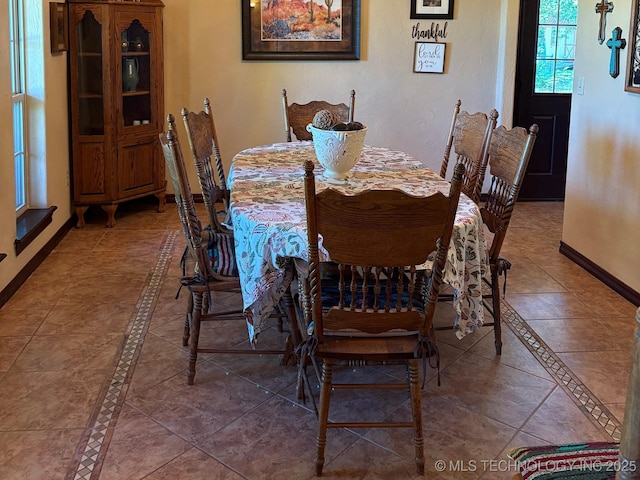 1216 N Oak Grove Rd, Drumright, OK 74030 - tiled dining area featuring baseboards and inlaid floor details