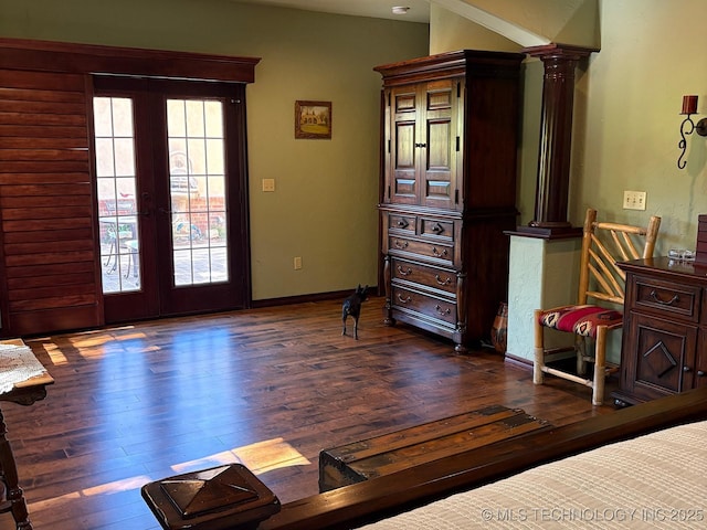 1216 N Oak Grove Rd, Drumright, OK 74030 - bedroom with ornate columns, dark wood finished floors, and french doors