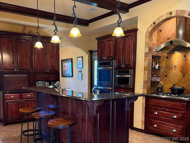 1216 N Oak Grove Rd, Drumright, OK 74030 - kitchen with reddish brown cabinets, wall chimney range hood, ornamental molding, gas cooktop, and double oven