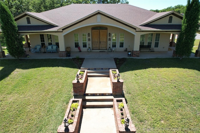 1216 N Oak Grove Rd, Drumright, OK 74030 - view of front facade featuring roof with shingles, a front yard, and a patio area