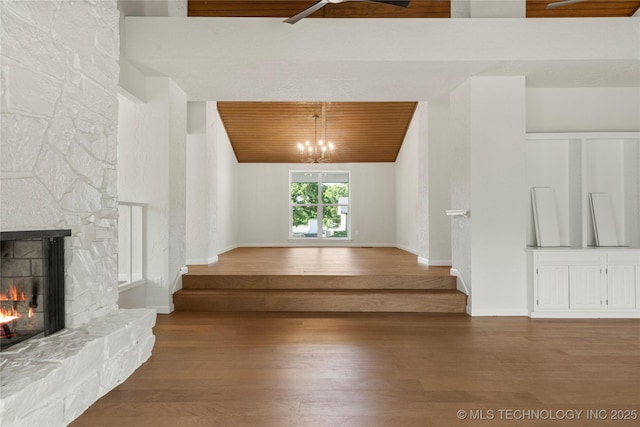3442 E 75th Pl, Tulsa, OK 74136 - stairway with a fireplace, wood ceiling, wood finished floors, baseboards, and lofted ceiling