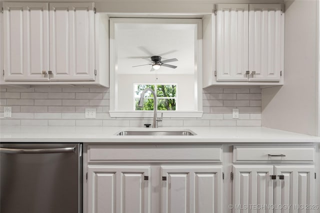 3442 E 75th Pl, Tulsa, OK 74136 - kitchen featuring stainless steel dishwasher, a sink, ceiling fan, light countertops, and white cabinets