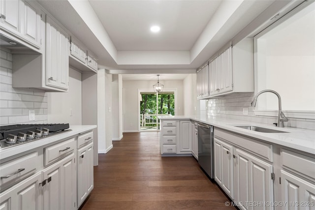 3442 E 75th Pl, Tulsa, OK 74136 - kitchen with stainless steel appliances, a sink, light countertops, decorative backsplash, and recessed lighting