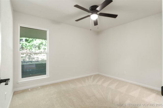 3442 E 75th Pl, Tulsa, OK 74136 - spare room featuring carpet and baseboards