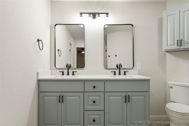 3442 E 75th Pl, Tulsa, OK 74136 - full bath with toilet, double vanity, and baseboards