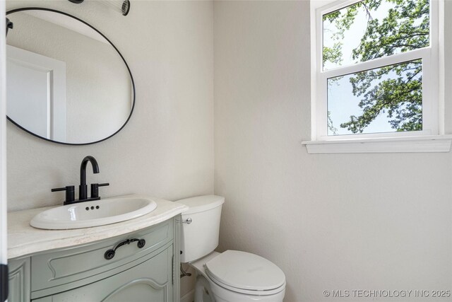 3442 E 75th Pl, Tulsa, OK 74136 - half bathroom with toilet and vanity