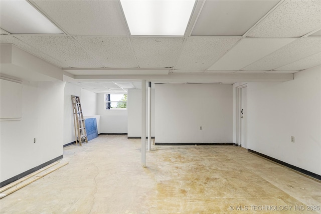 3442 E 75th Pl, Tulsa, OK 74136 - below grade area featuring a drop ceiling and baseboards