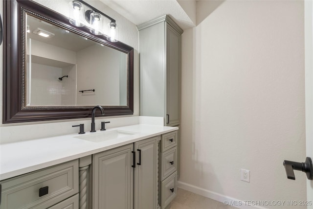 3442 E 75th Pl, Tulsa, OK 74136 - bathroom featuring baseboards and vanity