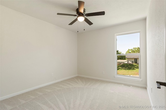 3442 E 75th Pl, Tulsa, OK 74136 - empty room featuring light carpet, baseboards, and a ceiling fan
