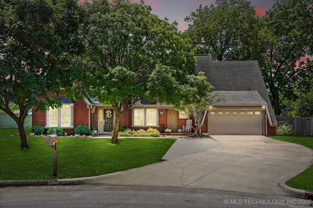 3606 E 70th Pl, Tulsa, OK 74136 - view of front of house with driveway, brick siding, and a garage