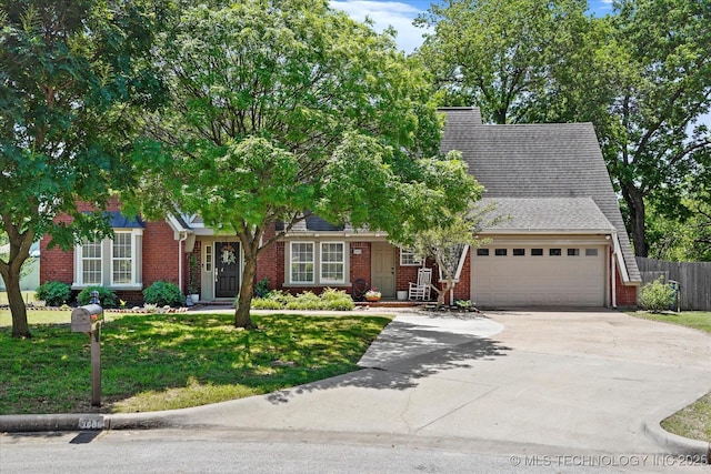 3606 E 70th Pl, Tulsa, OK 74136 - view of front of house with brick siding, concrete driveway, and an attached garage