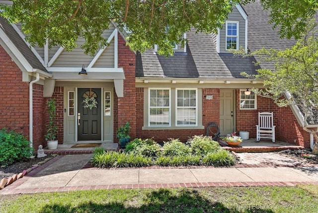 3606 E 70th Pl, Tulsa, OK 74136 - view of front of home featuring brick siding and a shingled roof